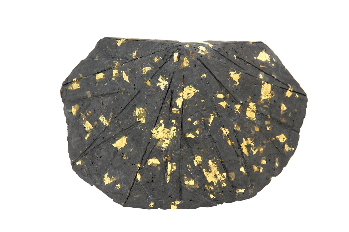 Shelter, 1983, a low charcoal-grey cast-paper sculpture scattered with gold leaf