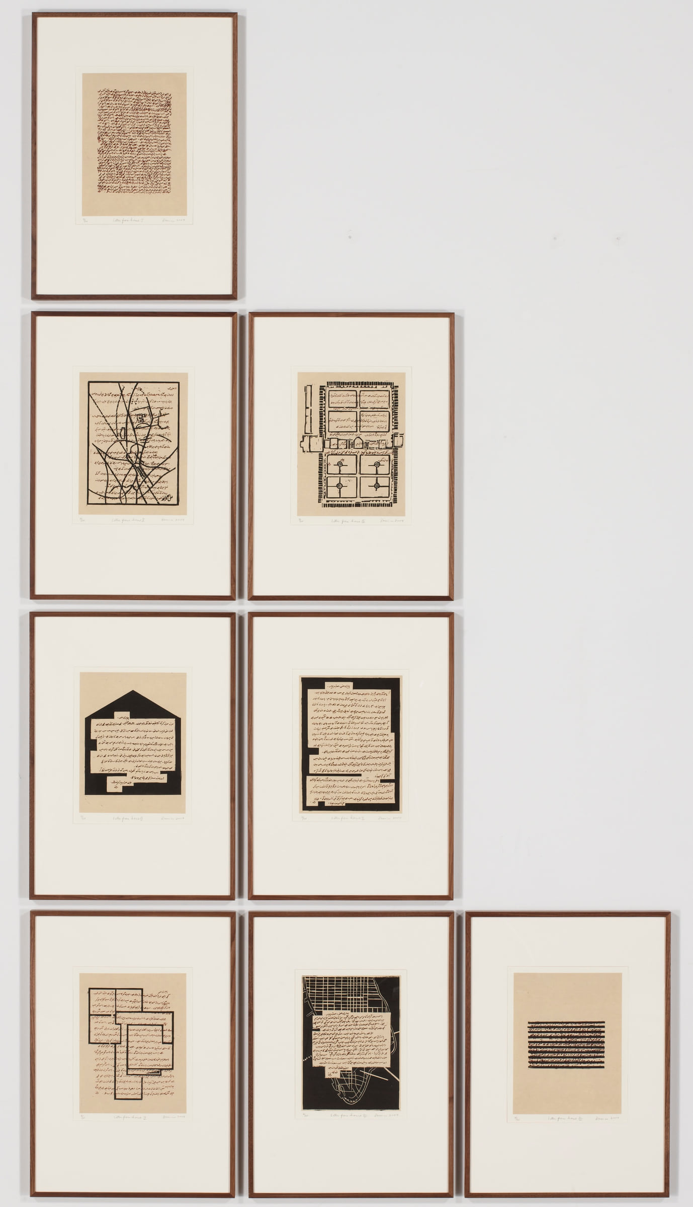 Installation of Letters from Home, 2004, eight framed prints arranged across a white wall