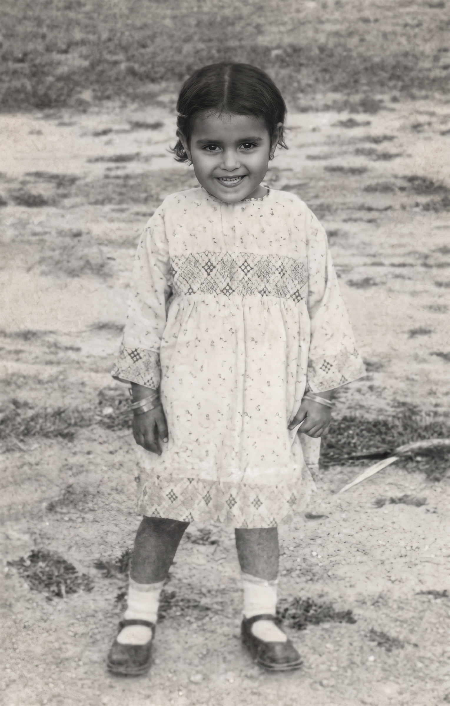 Zarina as a young child outdoors in Aligarh